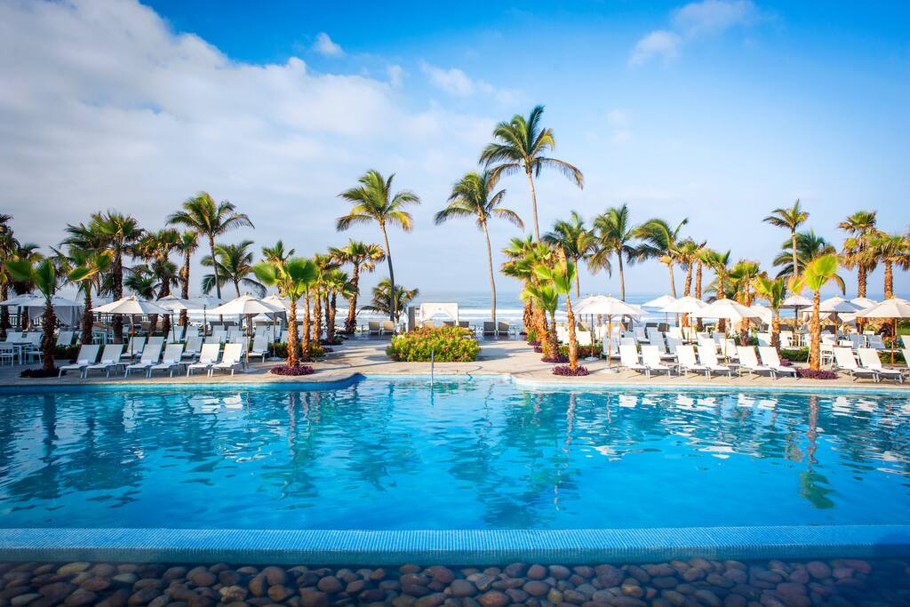 Lounge on a poolside chaise or float on the lazy river that wraps around the main pool.