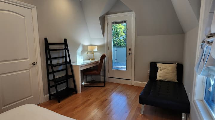 Corner chaise and corner desk work station.  Closet on left. 