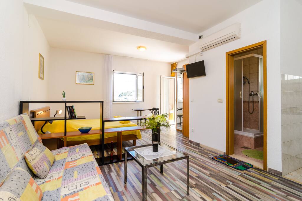 Room and living area equipped with SAT TV set