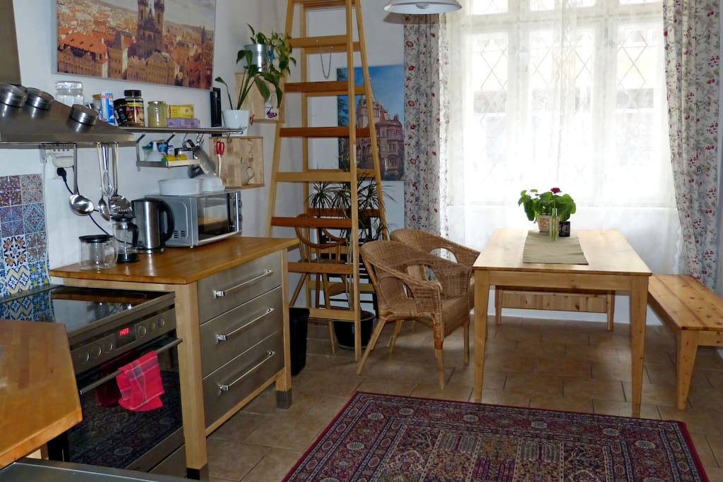 The table is expandable, see the board under the window? It makes easily table for six and more.