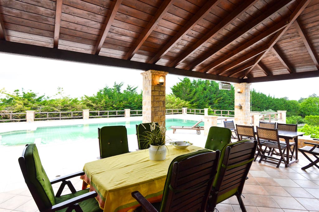 Outdoor dining area by the pool