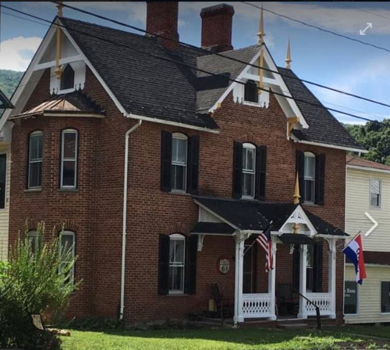 Circa 1878 Brick Victorian that houses Antler Suite, Room One South & Room One North