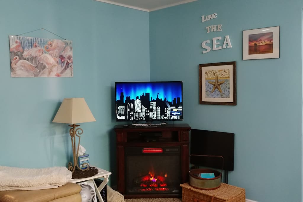 Electric Fire Place and Roku TV make staying in on a cool evening a cozy alternative to going out for other local entertainment.