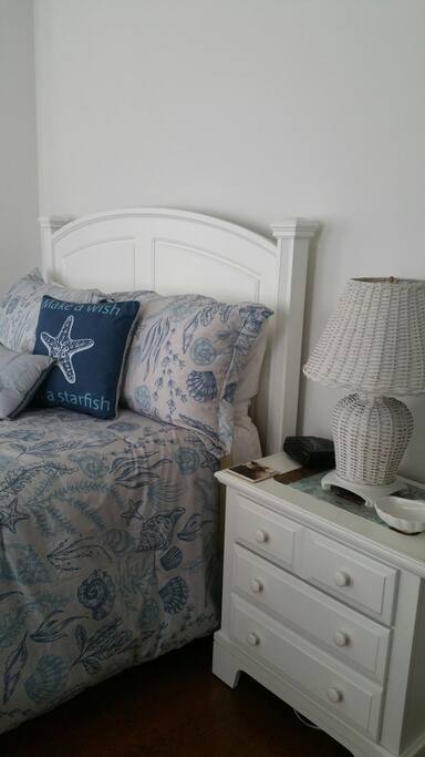 The suite is tastefully decorated with beach theme decor and bed linens.