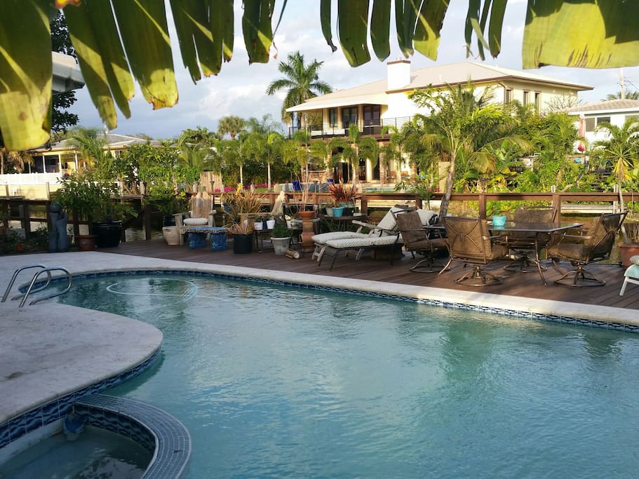 Backyard features.. a 70ft Ocean access waterfront, 60ft bilevel dock, free form pool surrounded by lounge chairs, tables and tropical foliage and pool floats ..outdoor mood lighting and surround speakers .. Plug directly in your smartphone/iPad directly into my system if you wish and enjoy your own music selections indoors or out ...fishing rods available for the angler in you.. The canal is very healthy and teeming with fish!