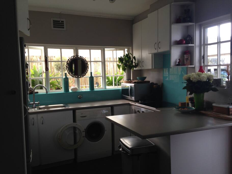 small open plan kitchen onto lounge dining room