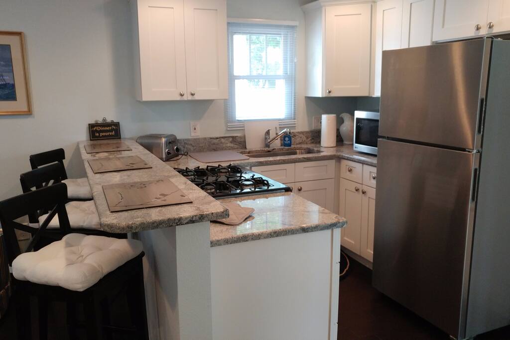 Kitchen with granite island bar