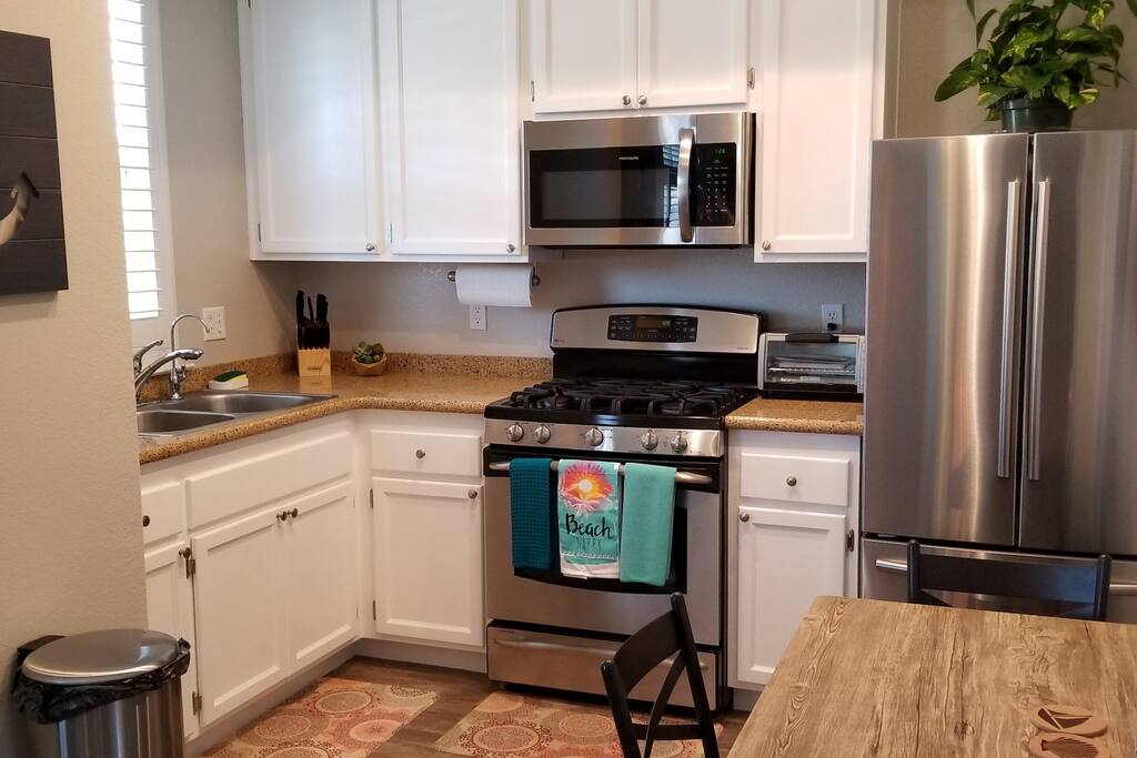 To the left of the microwave is everything you need to cook and enjoy waffles in the morning.
