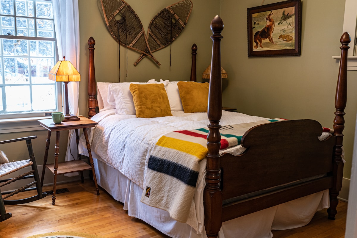 Ravvin Bedroom- Sunny main floor bedroom . Settle in to this 1860 4 poster bed with a new queen mattress or sit by the window and have your morning coffee.  A period cherrywood desk, butternut dresser and  full closet.