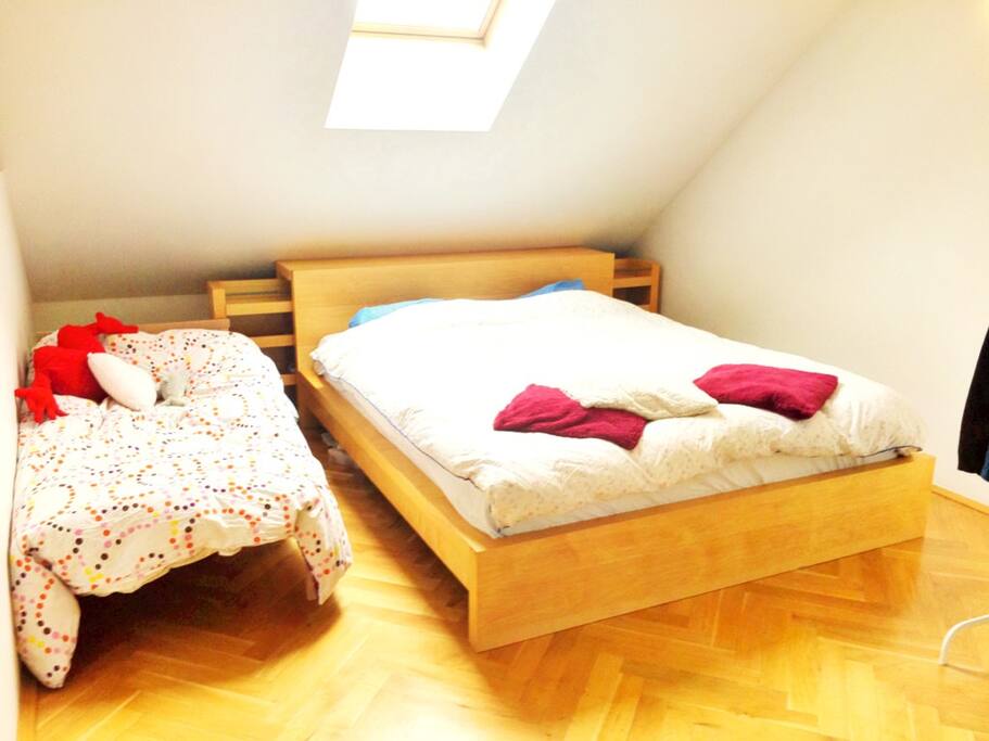 Bedroom w/ queen sized bed + toddler bed