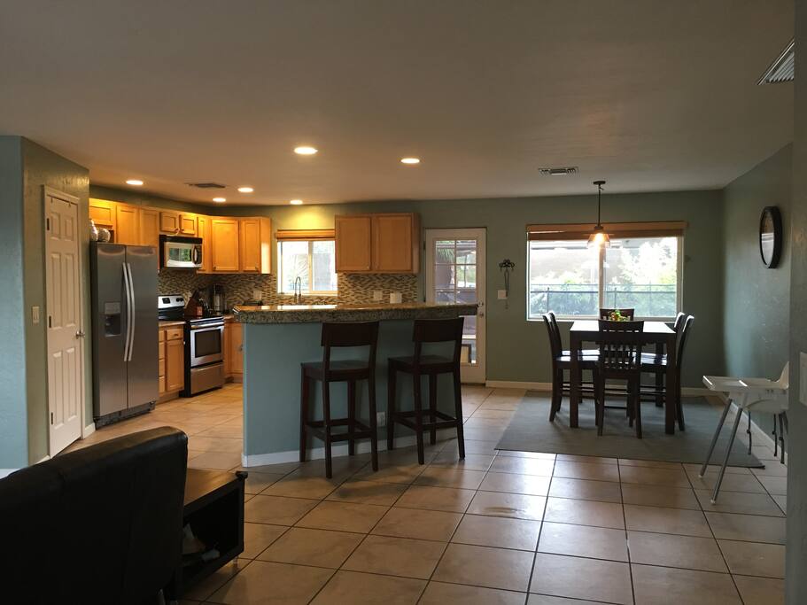 Open floor plan living, dining, and kitchen.