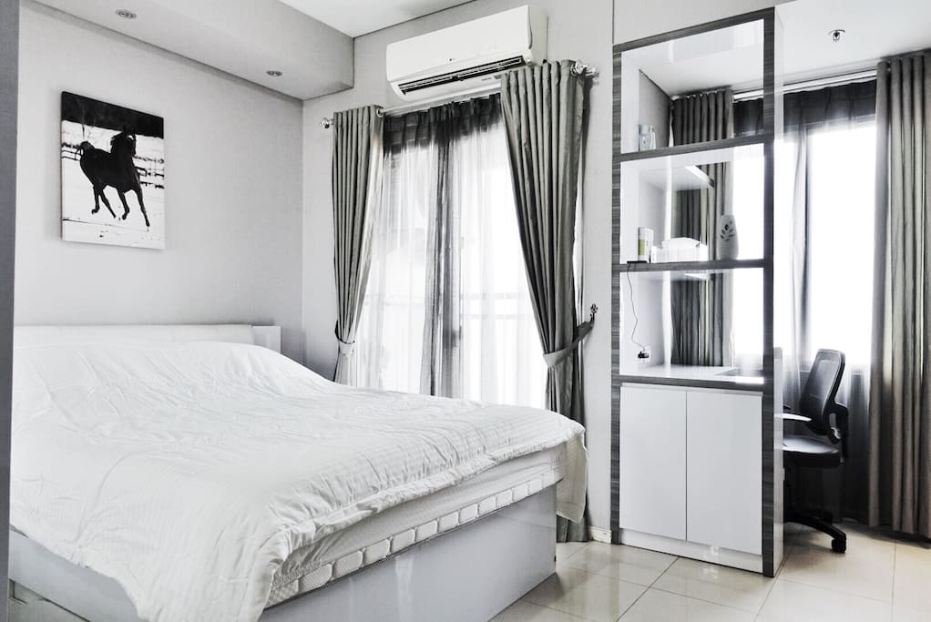 Queen Bed, Air Conditioner, Small working space, large window and shades