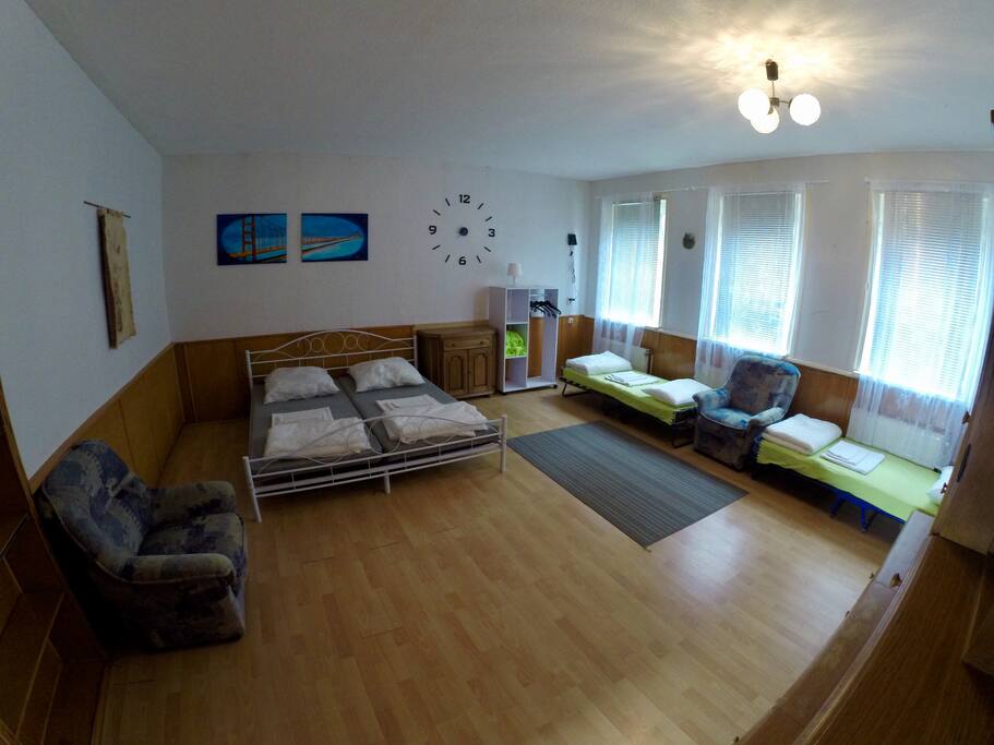 Bedroom 2 (living room). ~35m2. Two additional beds (green on the photo) provided per request