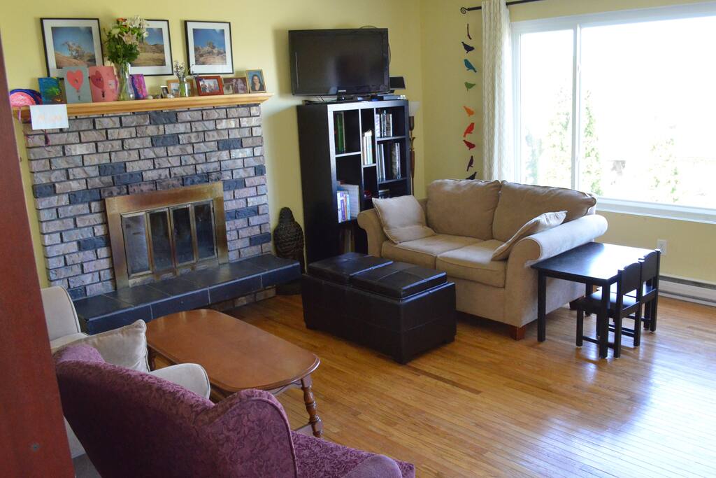 Living room with wood burning fire place