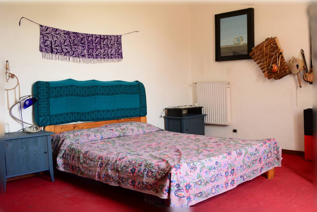 The room is large, comfortable and full of colors and good energy