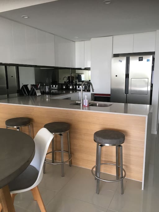 Kitchen with ‘breakfast bar’ seating...
Large fridge/ freezer combo. Includes dishwasher, toaster, kettle, Nespresso Machine and Nutri Bullet (necessities in life right?)