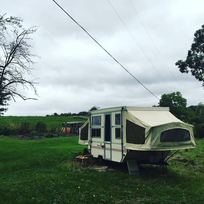 The view of the camper looking east towards our garden which features rabbits and chickens.