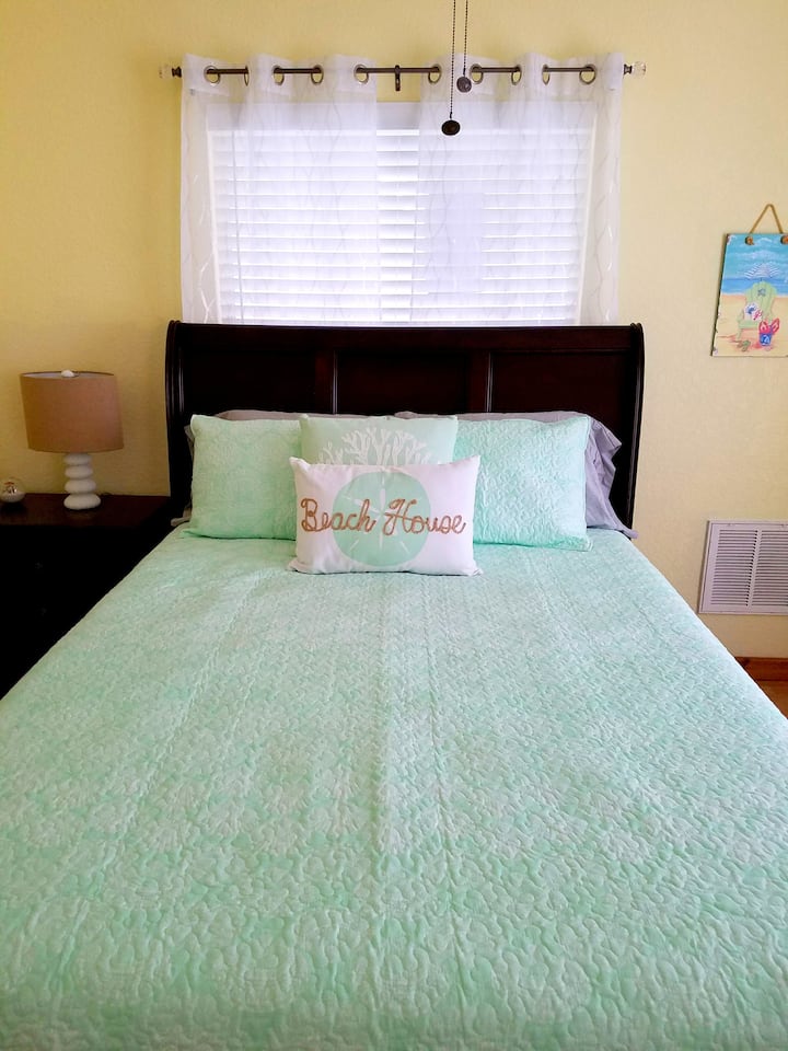 Bedroom 2 features a queen sized bed and closet.