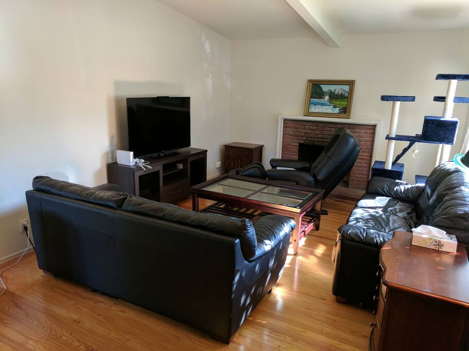 Living room w/ massage chair & Nintendo Wii (also have a Nintendo Switch too). Note that while there is a cat tree there, there are no cats in the house (I used to have cats).