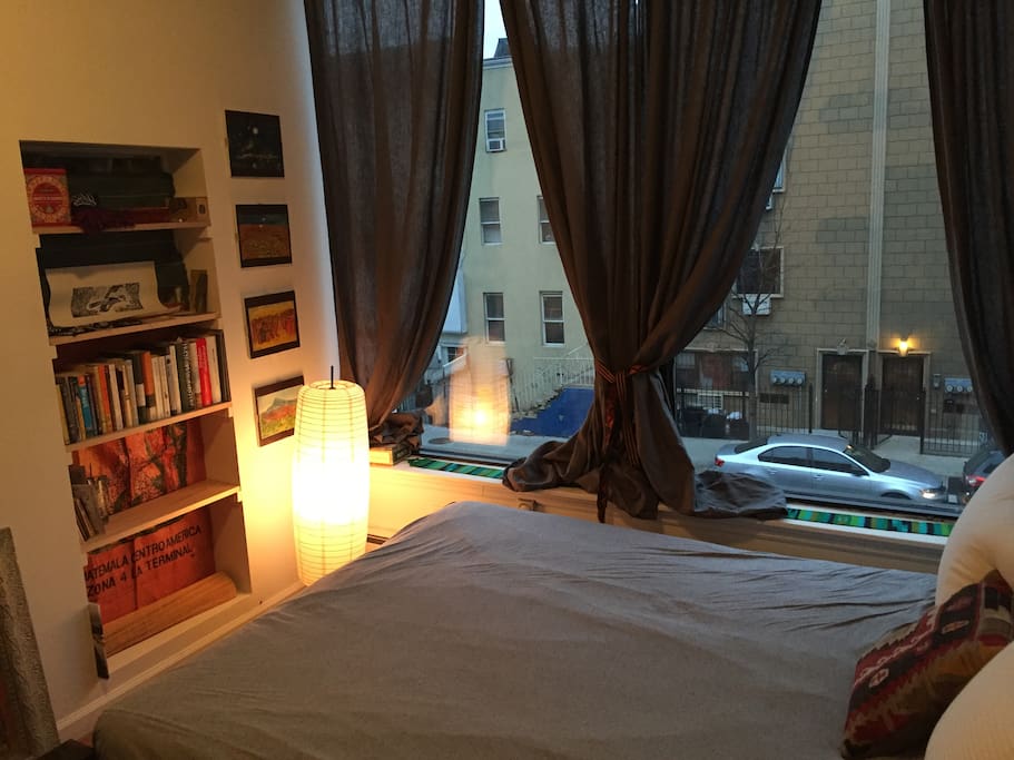 Bedroom - huge street side window with shelving
