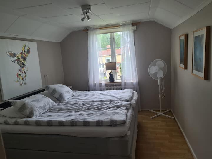 Bedroom 1 upstairs with two single beds and separate sink on the left side, not visible in the picture.