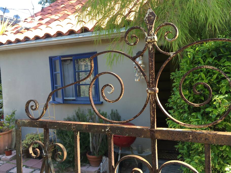entrance to the back yard and doorway to the guest house
