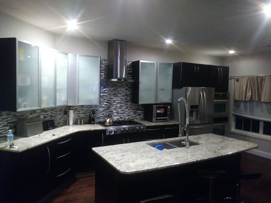 modern kitchen furnished with all amenities.
