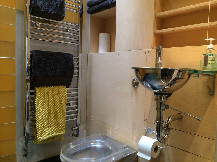 lovely wetroom, slate floor, grey towels, expelair and velux window