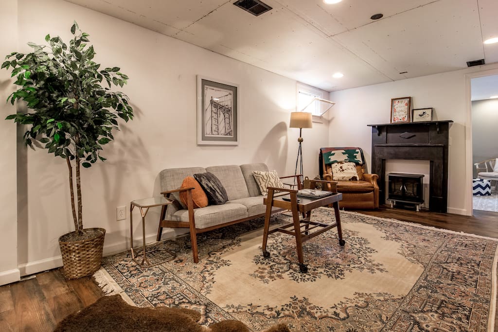 Living Room (the current couch is black, switched it out for a futon to easily accommodate more people!)