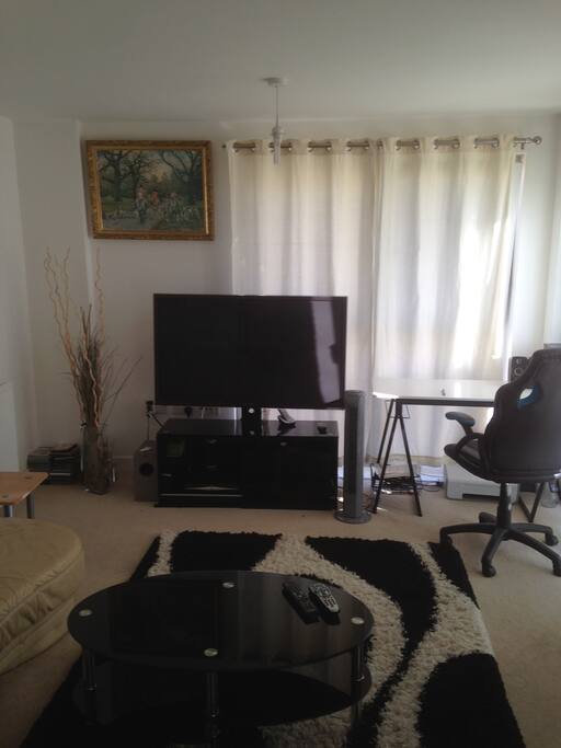 Living Room with TV, Large corner sofa and computer table+chair