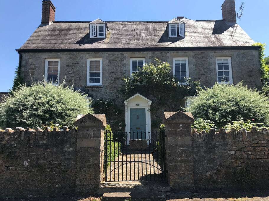 The front of The Old Vicarage showing the front door. Gardens etc all hidden behind...