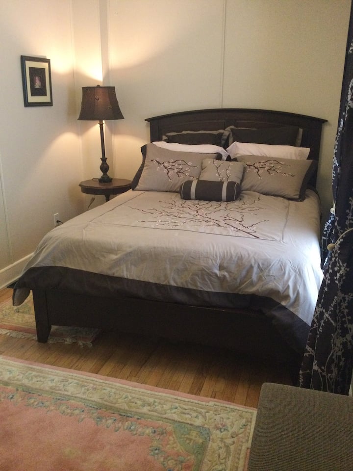 Master bedroom. Soothing cherry blossom decor. Large walk-in closet.