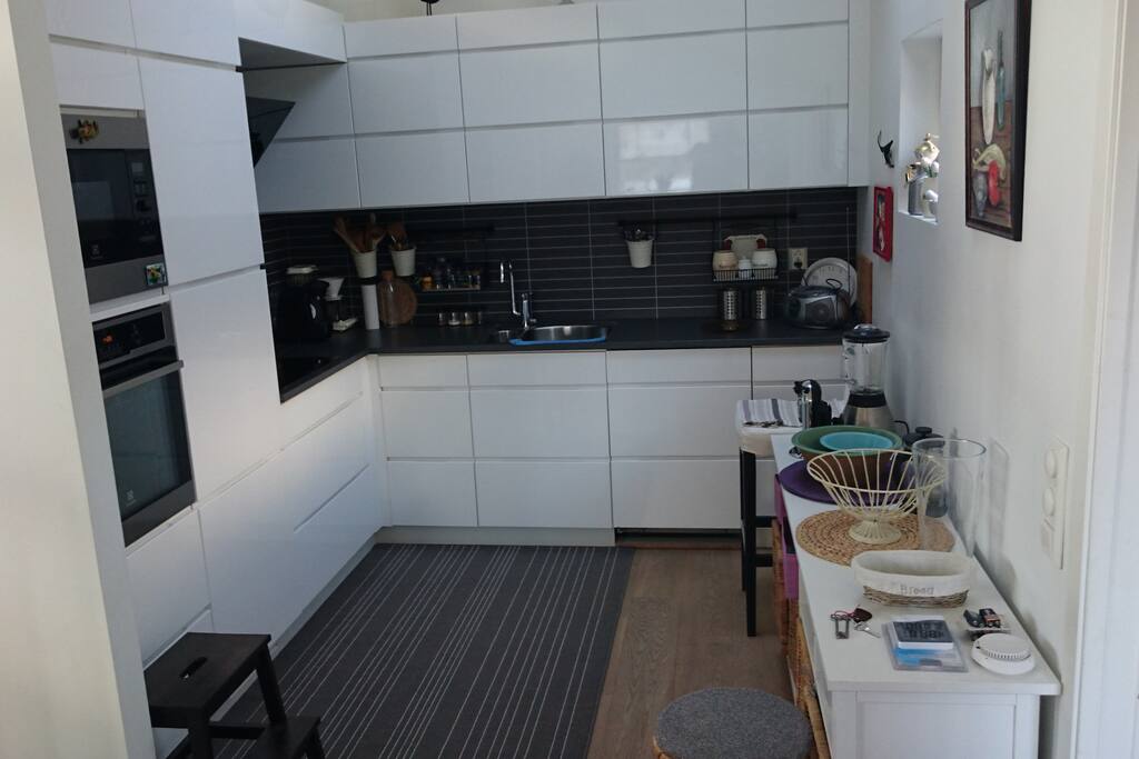 Kitchen with owen, micro, coffe-machine and dishwasher