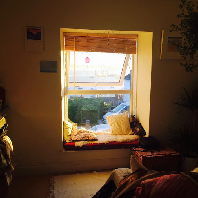 A perfect window seat for watching the sun rise and set over the water.