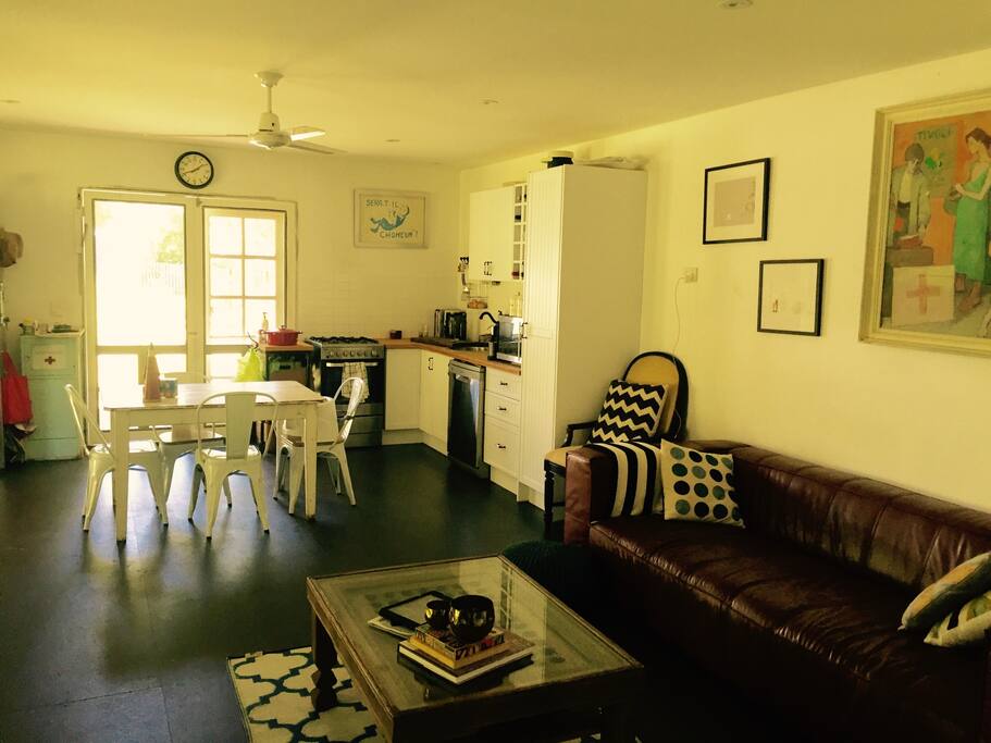 Eat in kitchen with double open French doors all sides. 4 seater lounge in small, functional and stylish living area.