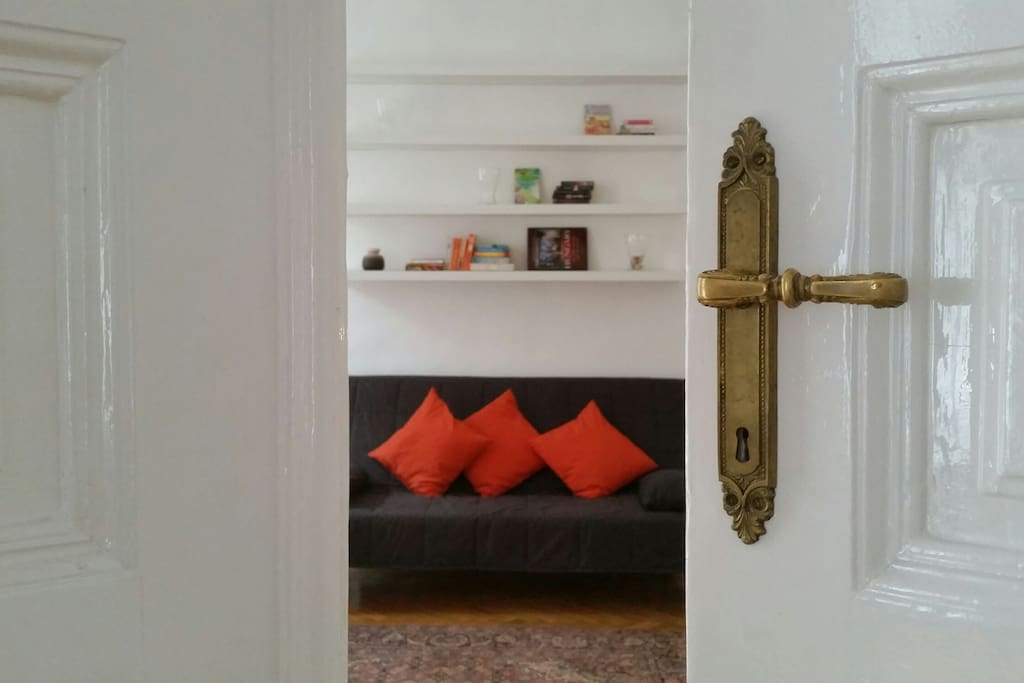 Master bedroom from the living room - beautifully renovated wooden door and handle