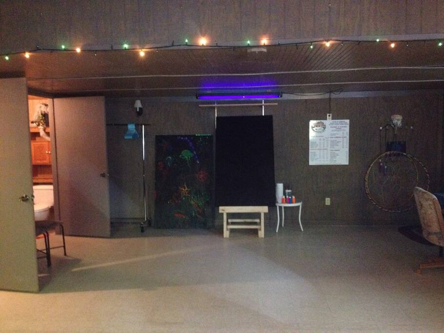 Leave your creative mark on our blacklight-paint party panel!