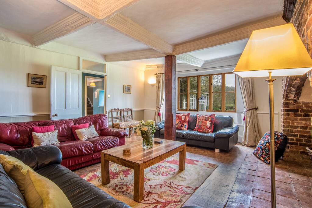 The comfy lounge, with spectacular views across the farm and garden