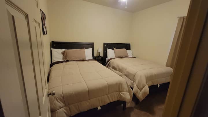 2nd bedroom with two regular-sized beds
