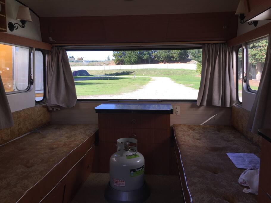Curtains all round for complete privacy! Fold away table.