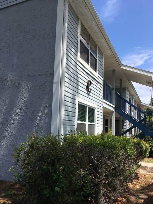Exterior of building. The apartment is located on the first level, with plenty of free parking available right outside