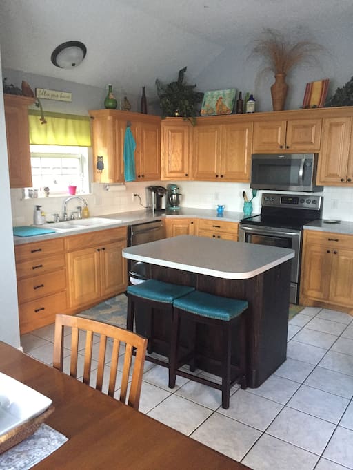 Eat in kitchen with large fridge and extra seating. Keurig available as well.