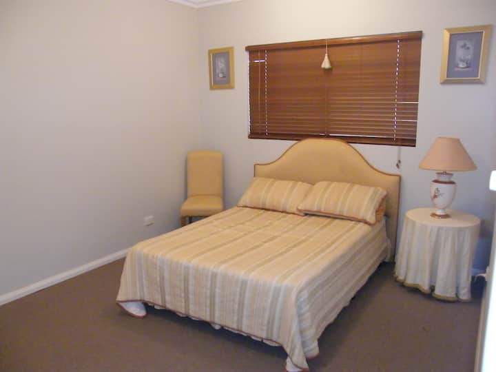 Double bedroom upstairs with double robe and next to lounge room upstairs