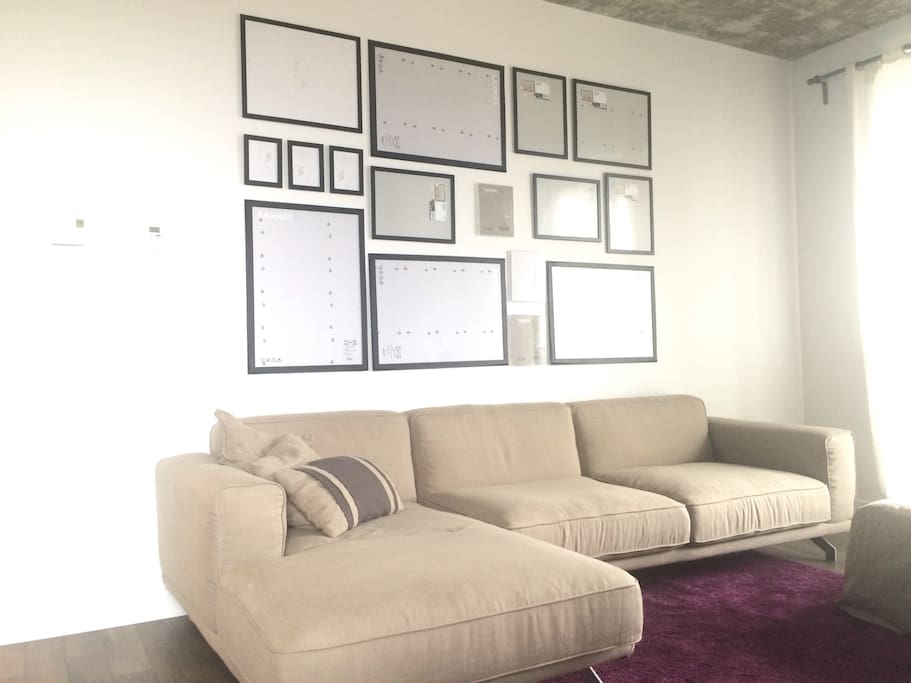 By the time you arrive, the frames will have photos. Hanging them was the hard part, so we got that out of the way first.