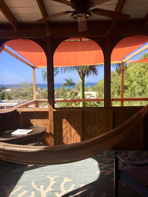 Zoomed out a bit. There's a hammock and panoramic view of the Caribbean.