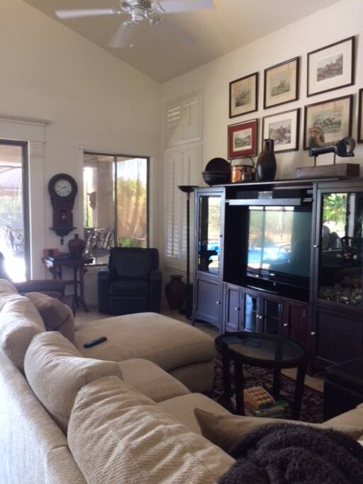 Great room with 2 recliners, overstuffed sofa with chaise lounge and TV