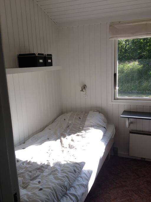 Bedroom 1 in the house, with two single beds.