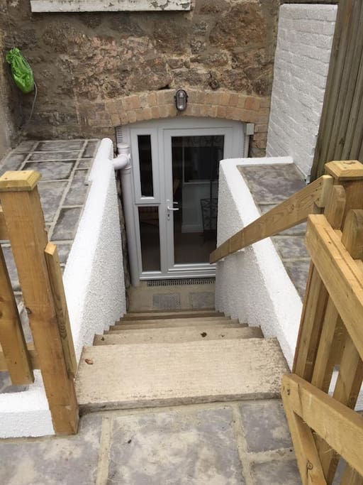 Steps going down to the basement room