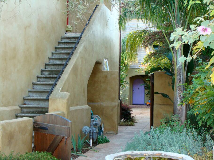 Our home is across the courtyard with the blue door.