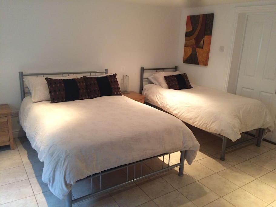 A double and a single bed in the bedroom